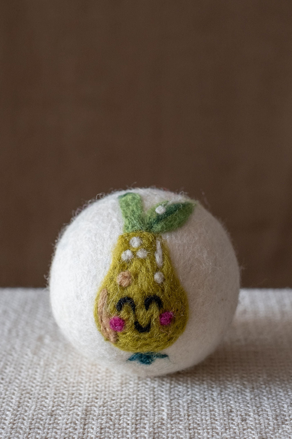 Pear wool dryer ball, studio photo