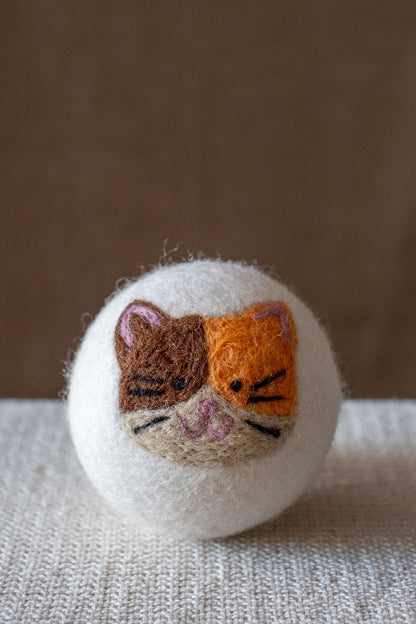 Calico wool dryer ball, studio photo