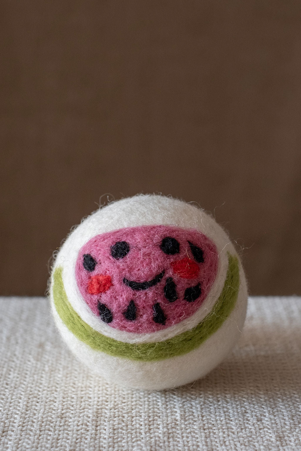 Watermelon wool dryer ball, studio photo