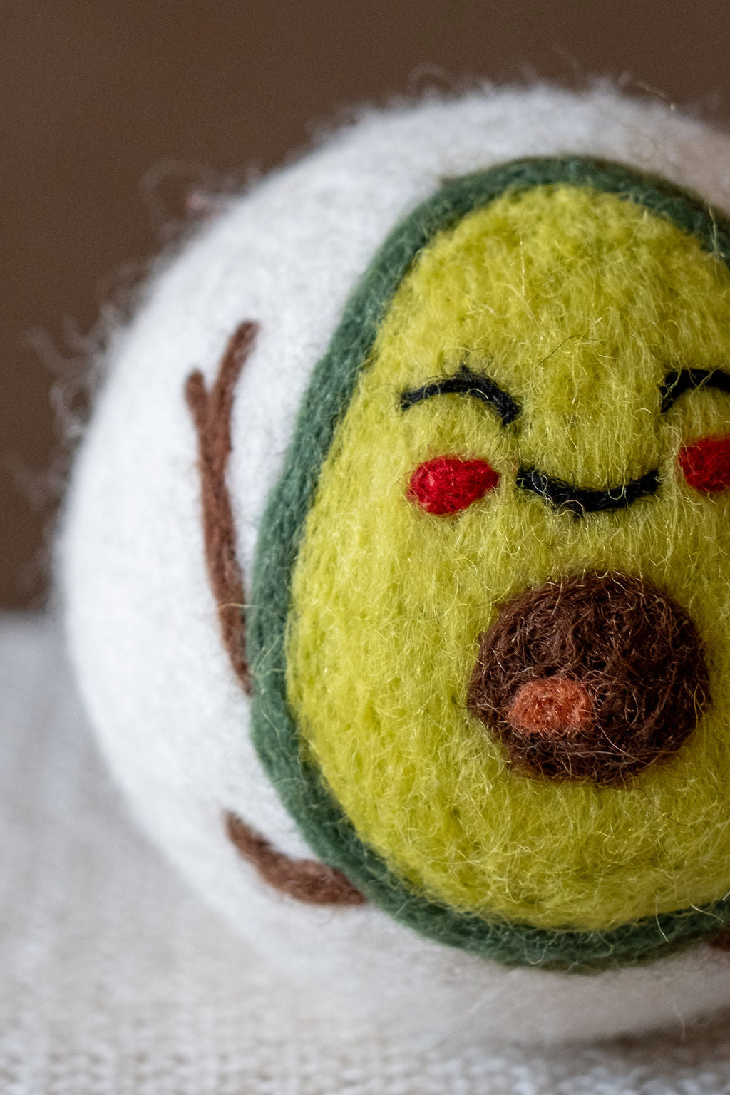 Avocado wool dryer ball, detail photo