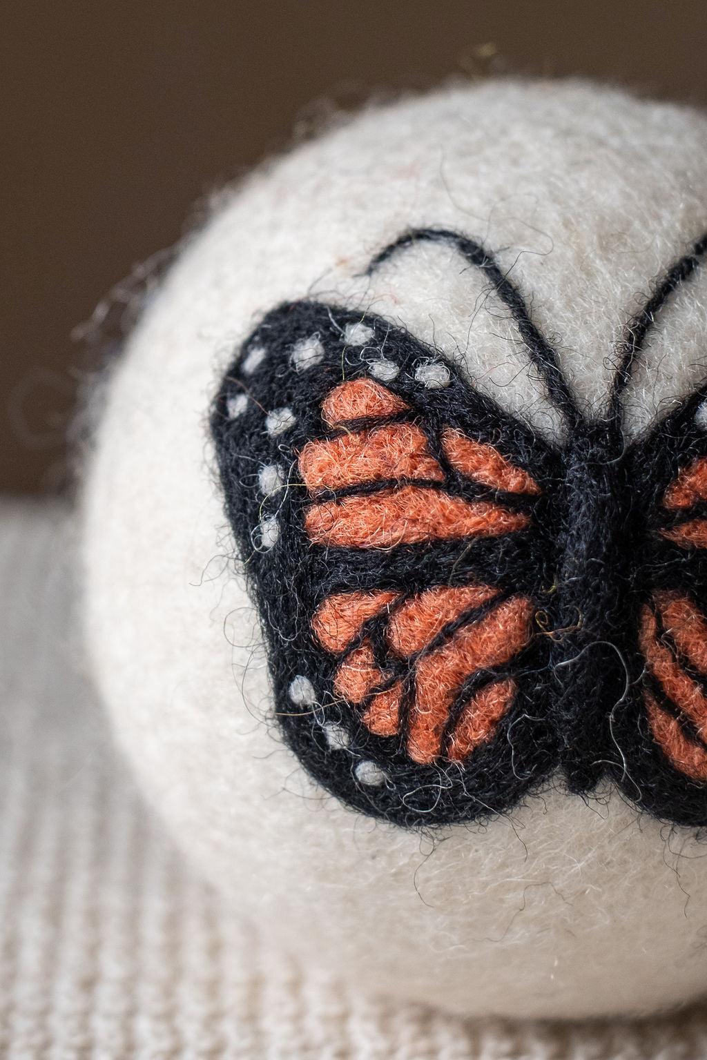 Golden Butterfly wool dryer ball, detail photo