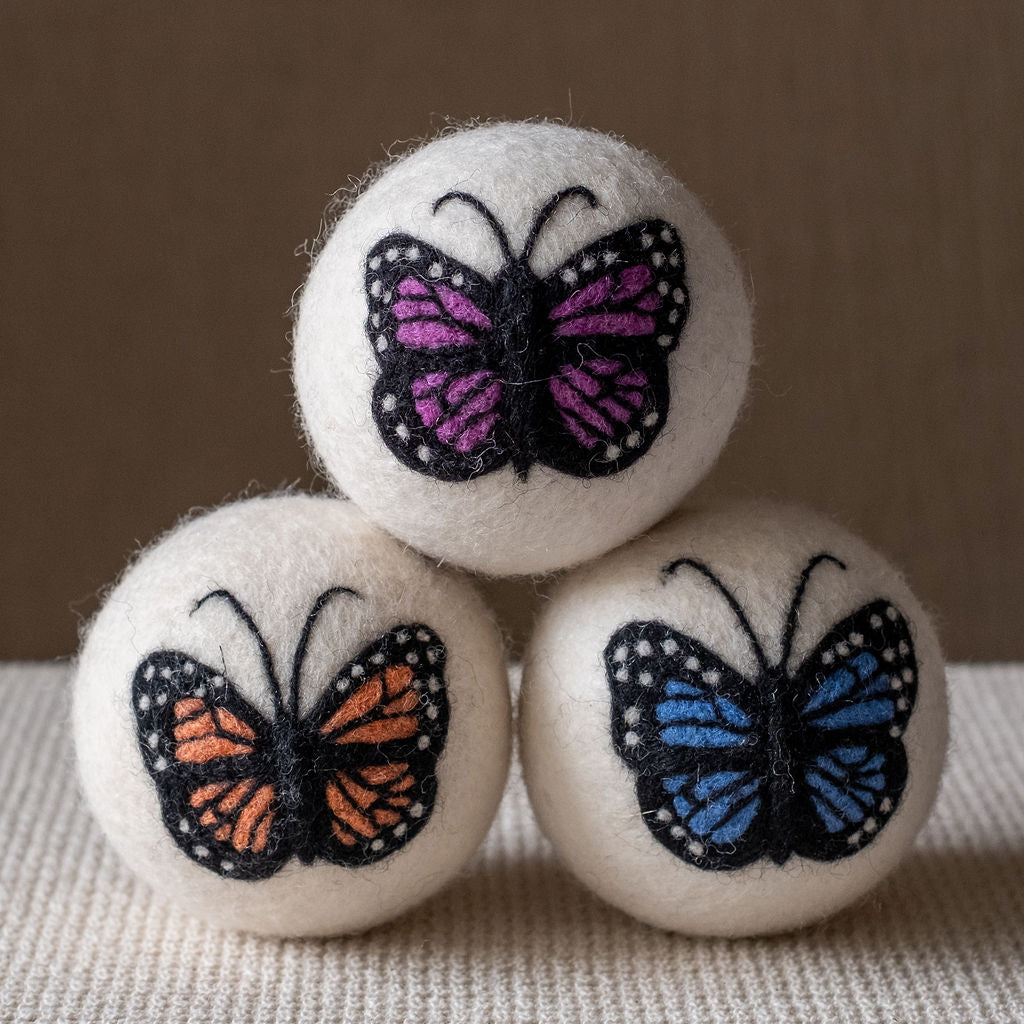 Butterflies set wool dryer ball, studio photo