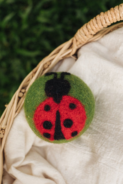 Lady Bug on Green Ball wool dryer ball, in use photo