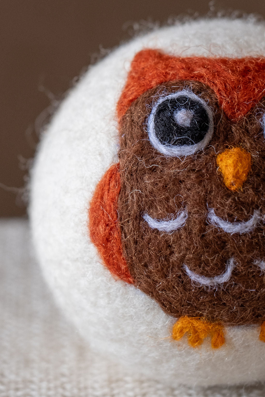 Brown Owl wool dryer ball, detail photo