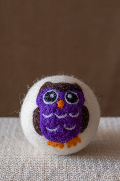 Purple Owl wool dryer ball, studio photo