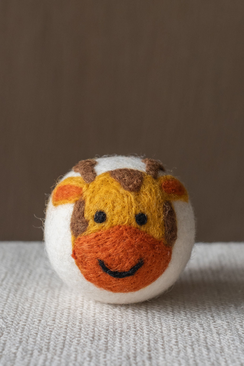 Giraffe wool dryer ball, studio photo