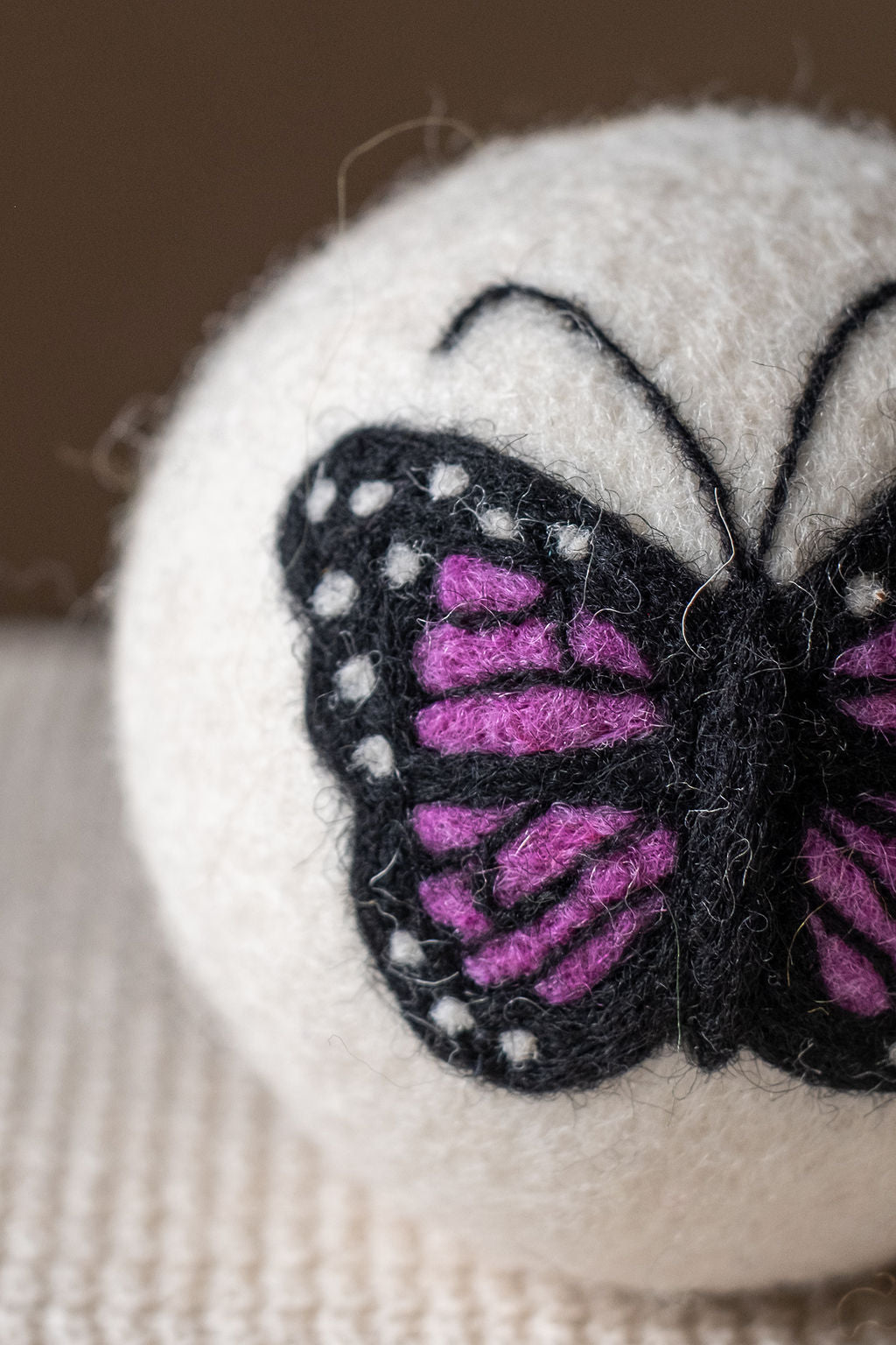 Purple Butterfly wool dryer ball, detail photo