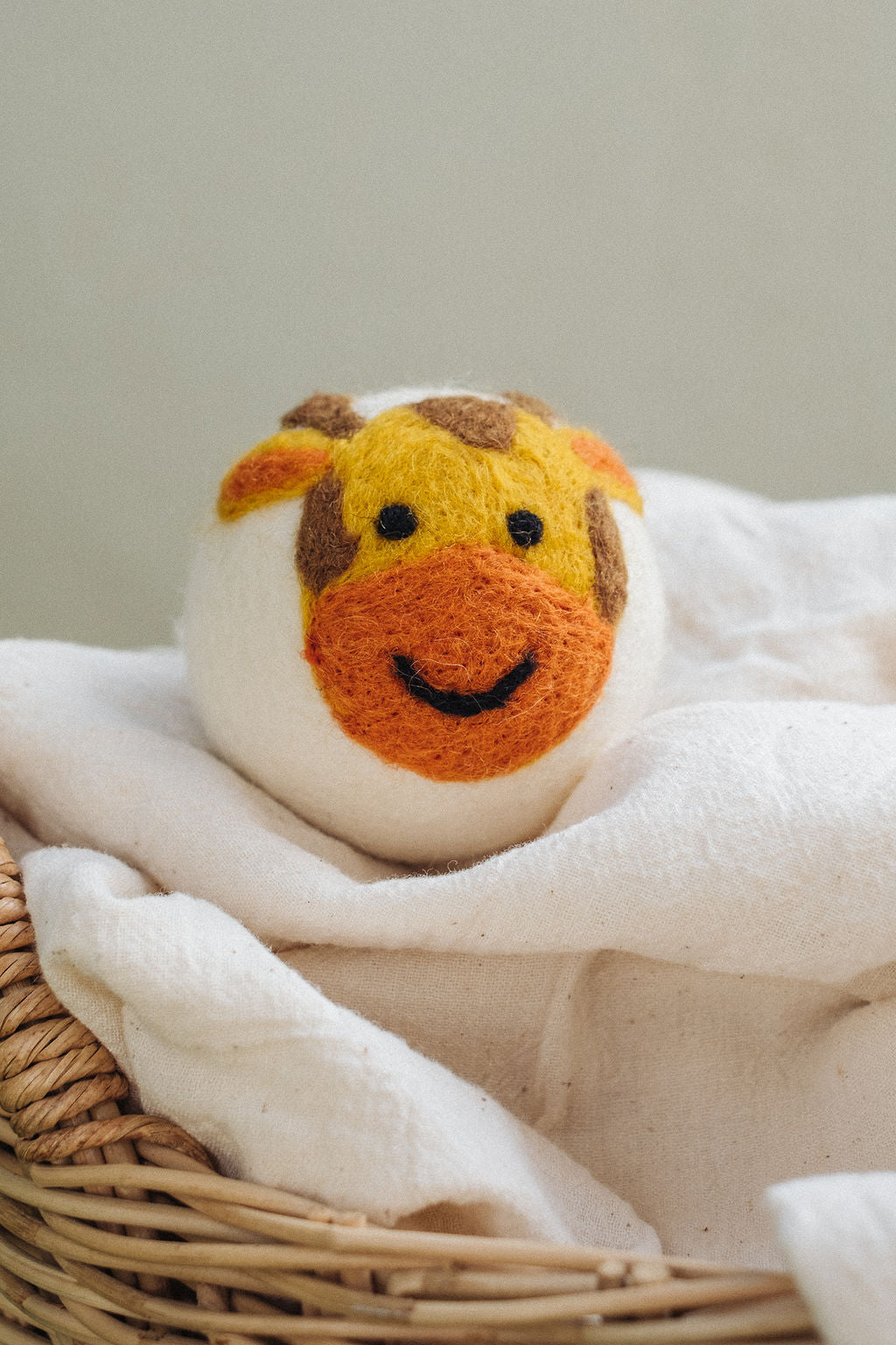 Giraffe wool dryer ball, in use photo