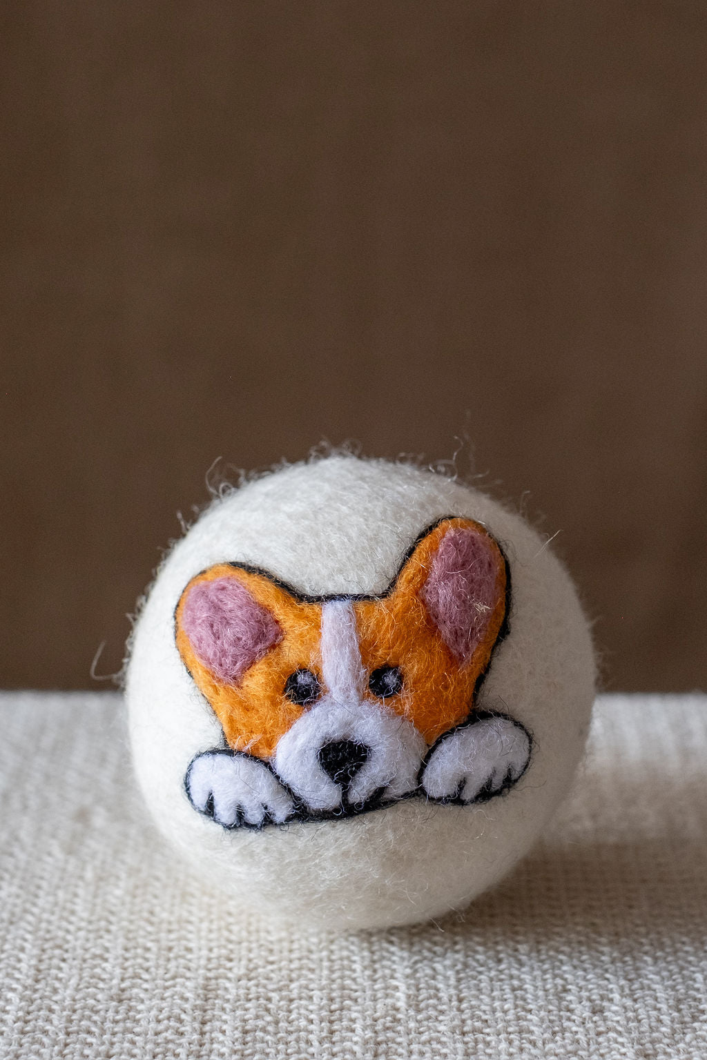 Corgi wool dryer ball, studio photo