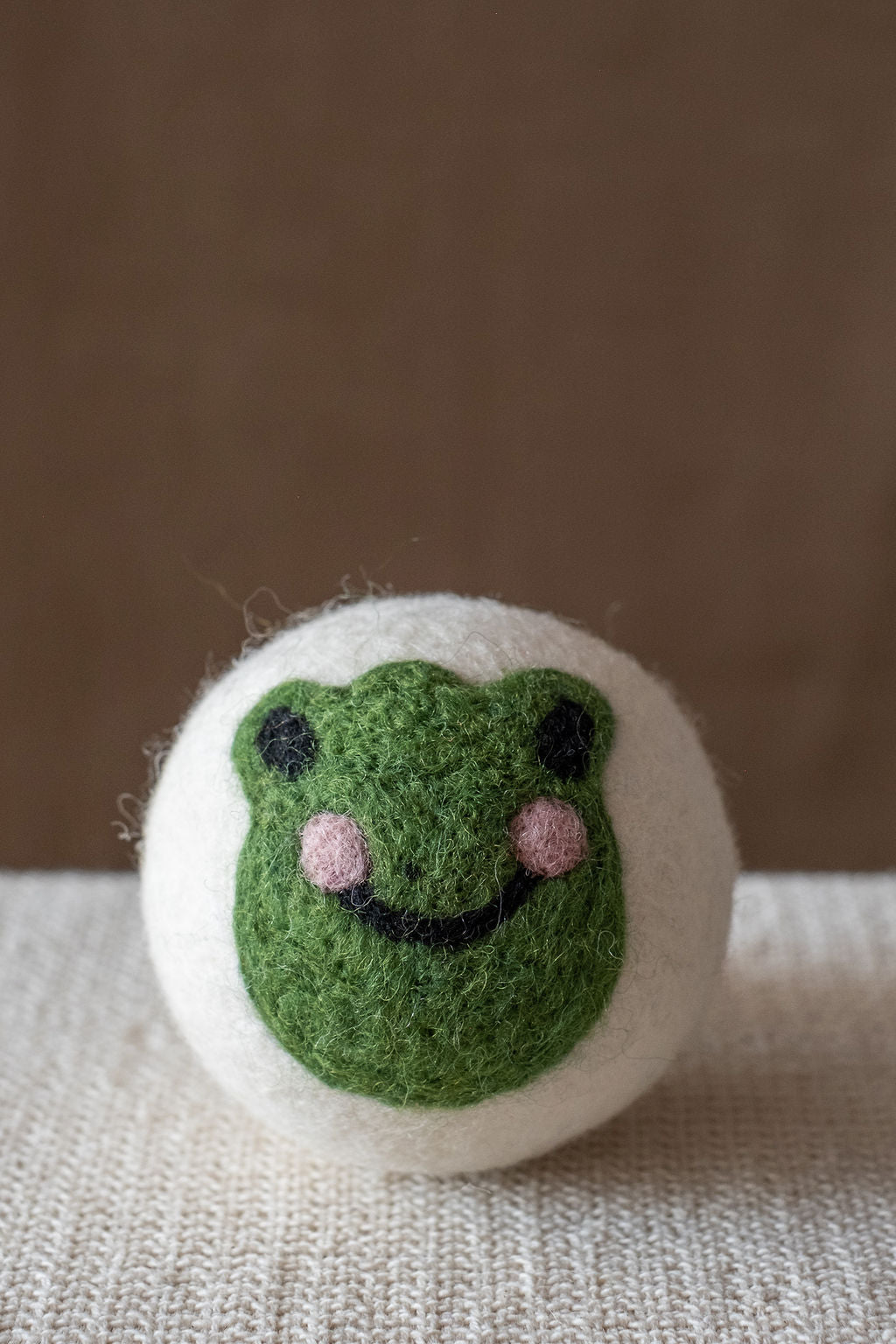 Frog wool dryer ball, studio photo