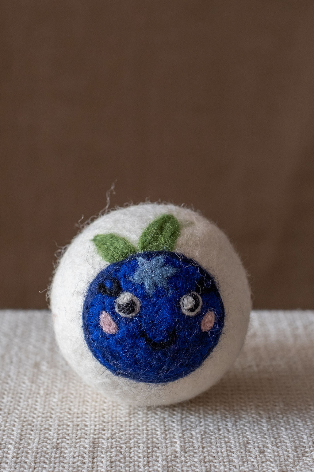 Blueberry wool dryer ball, studio photo