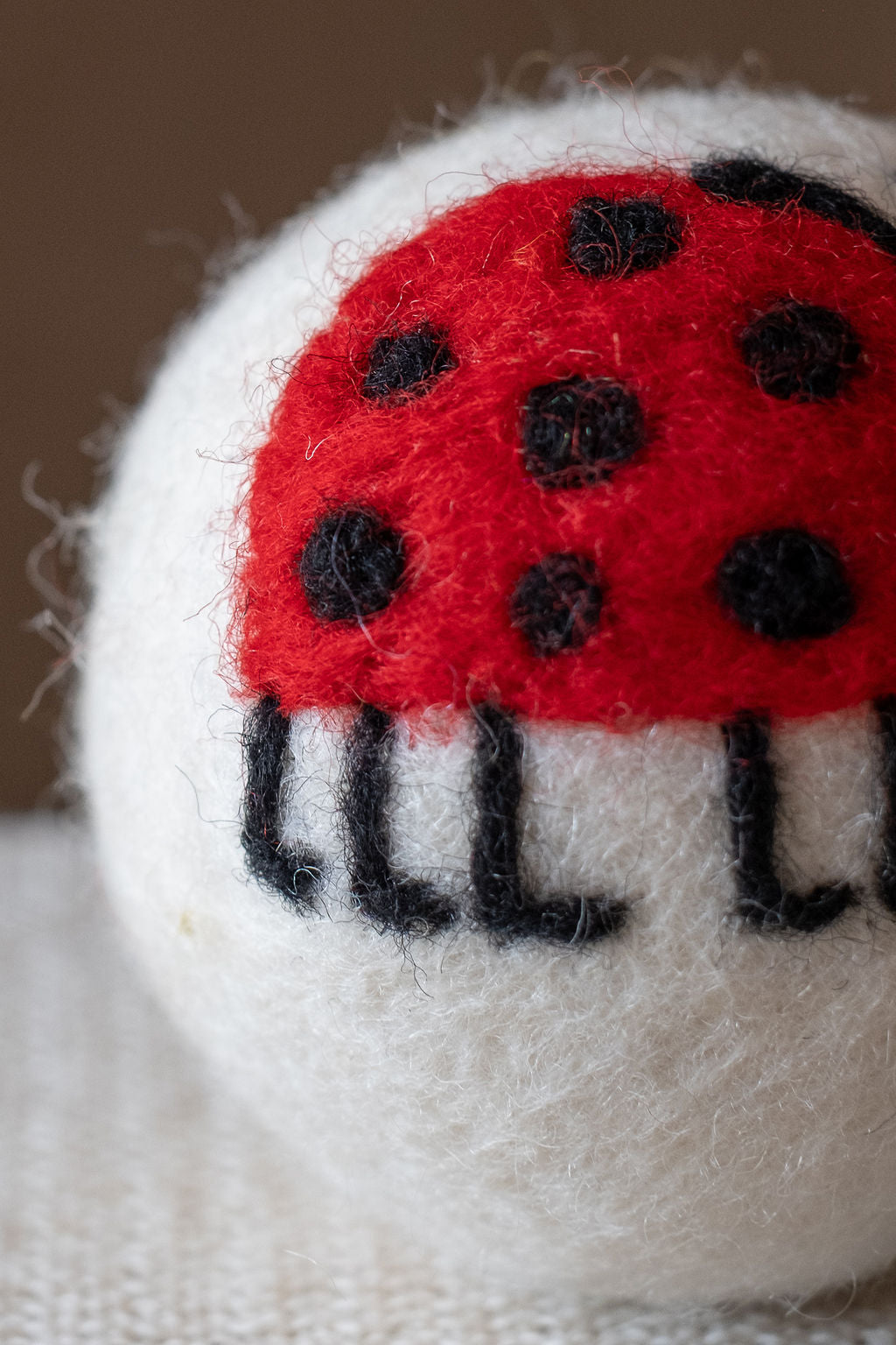 Lady Bug with Legs wool dryer ball, detail photo