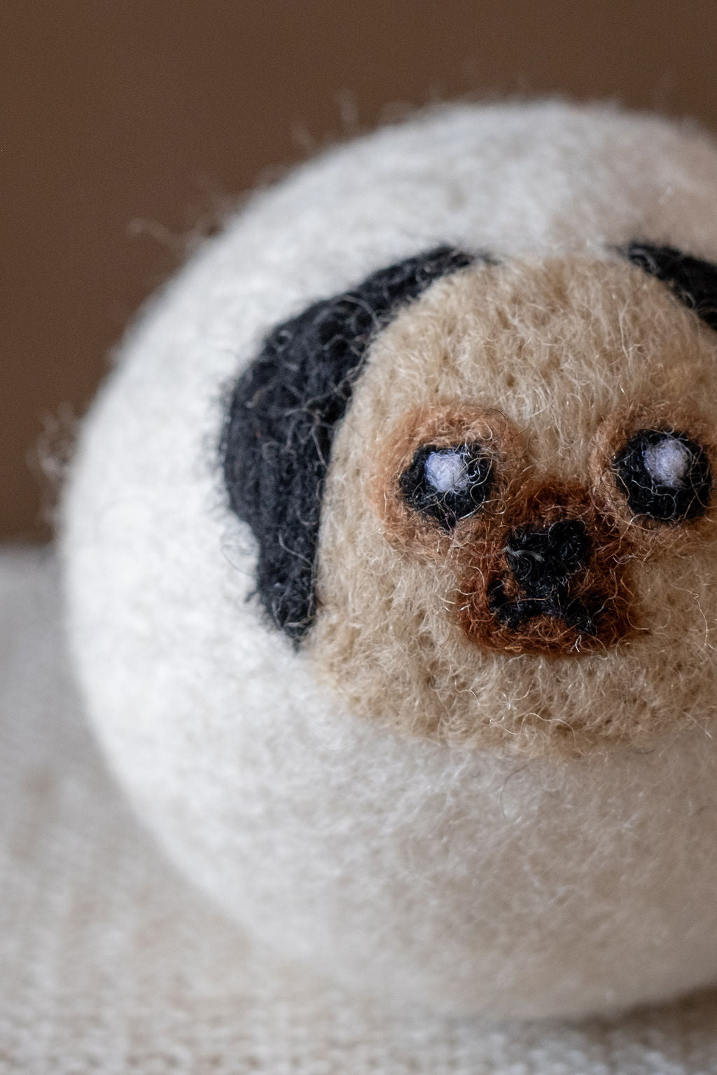 Pug wool dryer ball, detail photo