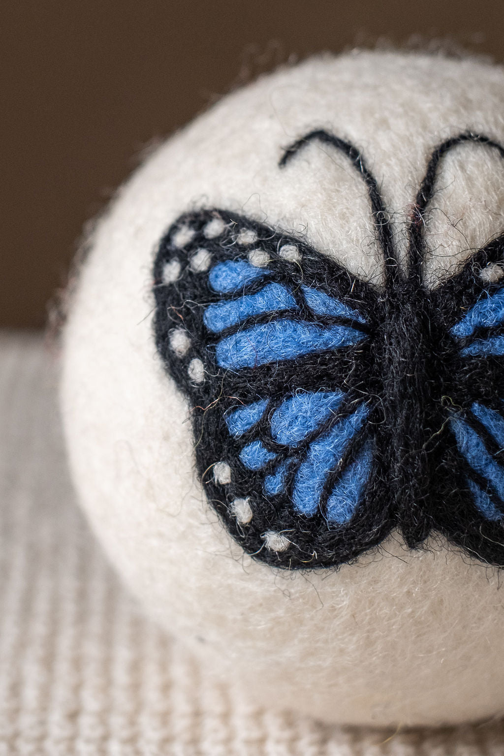 Close-up of the hand-felted Blue Butterfly design